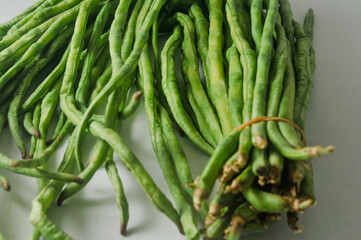A bunch of raw long beans isolated on a white background