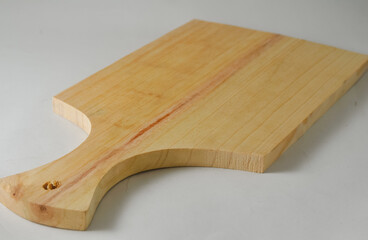 A wooden cutting board isolated on a white background