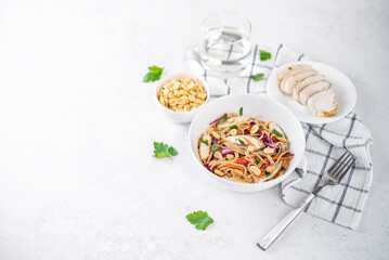 Warm backwheat pasta chicken vegetables salad with peanuts