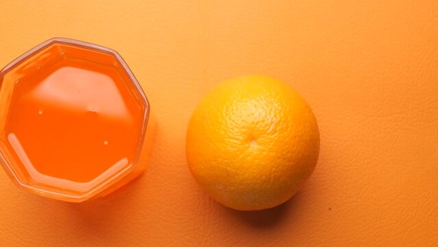 glass of orange juice and orange fruit on table 