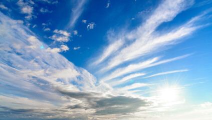 Blue sky with beautiful clouds and sun