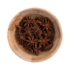 heap of star anise in wooden bowl isolated on white background, seasoning or spice top view