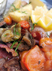 Roasted mix of vegetables Mix of vegetables paprika, mushrooms, peppers, zucchini, tomatoes. Dish ready to eat. Vegetarian dish. View from above. Close-up.