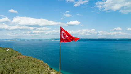 Turkish flag. Red Turkish flag waving on the sea.