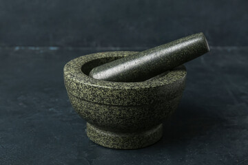 Mortar and pestle on dark background