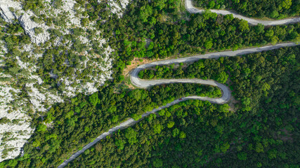 car driving on winding roads. Winding roads in the forest and the view from the top.