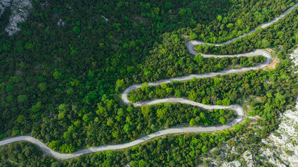 car driving on winding roads. Winding roads in the forest and the view from the top.