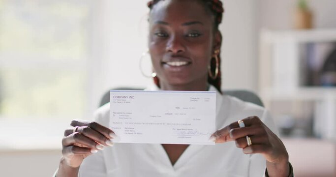 Holding Paycheck Or Payroll Check Or Insurance Cheque