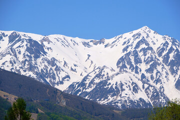 view of the mountain peaks on a sunny spring day in Hakuba, Japan