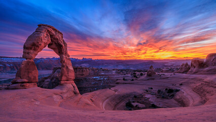 Delicate Arch and Sandstone Bowl at Sunset