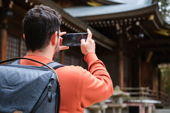 Tourist taking photo to Sakurayama Hachimangu Shrine in Takayama, Japan.