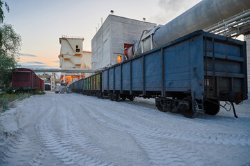 Freight gondola cars for limestone loading stand at factory