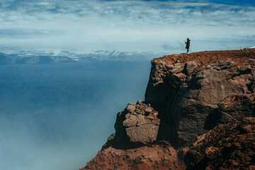 Fototapeta na wymiar a person standing on a rock