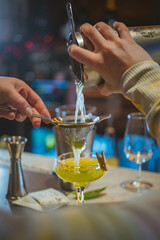 bartender pouring cocktail