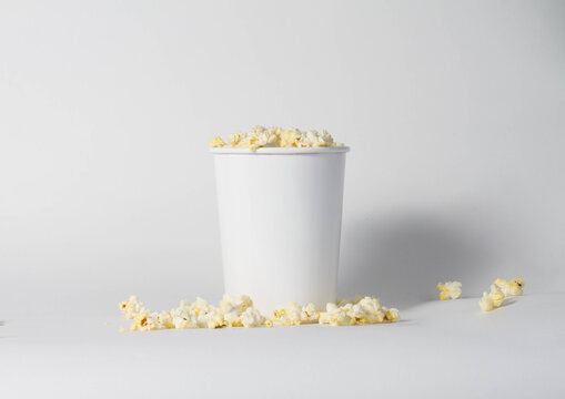 Blank white popcorn bucket mockup isolated, 3d rendering. Clear pop corn pail mockup fastfood front side view. Paper snack bucketful design mock up. 3D illustration.