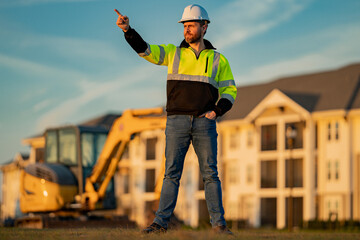 Portrait of worker small business owner. Construction worker with hardhat helmet on construction...