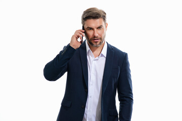 Fototapeta premium Portrait of handsome business man in suit using smartphone, chatting, making post on social media. Business man call on phone isolated over studio background. Blogger talking on phone.