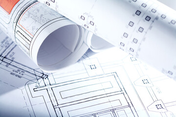 Close-up of blueprints with sketches of projects