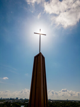 Photo of a cross on blue sky silhouette
