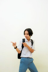 Indonesian male high school students wearing gray and white uniforms. Isolated on a White background.