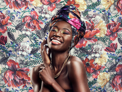 Head wrap, flowers and black woman with fashion, cheerful and happiness against floral background. Funny, happy model and female person with a turban, stylish and trendy with joy, smile and confident