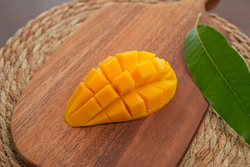 Ripe mango on wood,Ripe Mango Slice on wooden cutting board