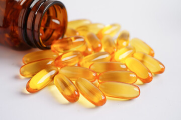 Fish oil or Cod liver oil gel in capsules with omega 3 vitamins, supplementary healthy food