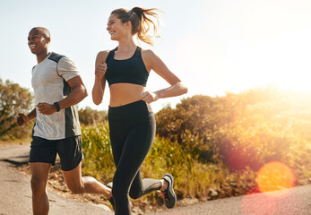 Fitness, running and health with couple in road for workout, cardio performance and summer. Marathon, exercise and teamwork with black man and woman runner in nature for sports, training and race - obrazy, fototapety, plakaty