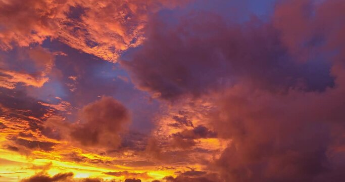 aerial view Bright golden yellow clouds dazzle the sky at sunrise..Bright red-orange sky, beautiful beyond imagination..drone shooting stunning sky full of colorful cloud..abstract nature background.