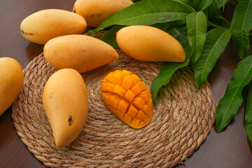 Ripe mango on wood,Ripe Mango Slice on wooden cutting board