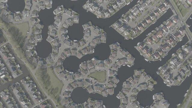 Top down view of symmetrical pattern of leisure housing in a harbour in Lemmer, Friesland, the Netherlands in DLOG colorprofile.