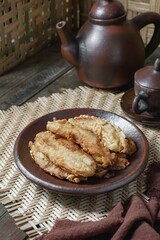 Fried jackfruit bananas on a plate. A portion of traditional food in Southeast Asia.