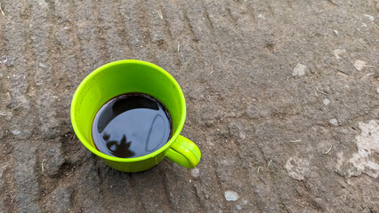 Hot coffee in a green cup