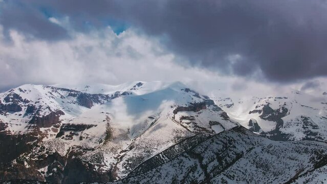 Breathtaking time lapse of the stormy clouds over the mountain peaks in Maiella National Park in Abruzzo, Italy shot with a 4K drone