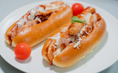 Cooking. Sandwich with sausage and tomato. Hot Dog.