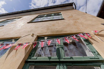 Flag. Flag of Denmark. Ancient street.