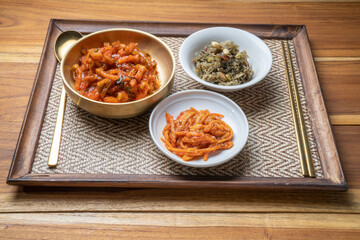 Korean food side dishes, Stir-fried Squid and Vegetables,Stir-fried Anchovies with Nuts and Sesame Leaf with aged Korean soy sauce and rich seasoning Korean traditional food.