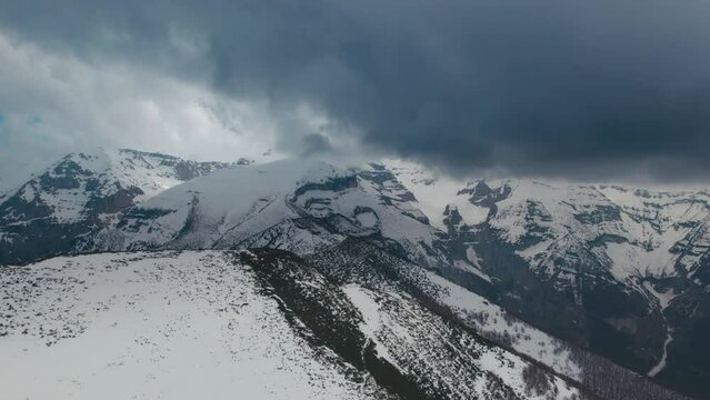 Breathtaking stormy clouds over the mountain peaks in Maiella National Park in Abruzzo, Italy shot with a 4K drone