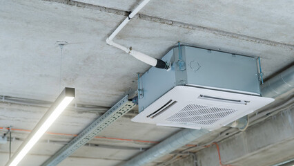 Industrial air conditioner in the office on a concrete ceiling. 