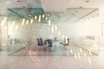 Fototapeta premium Double exposure of abstract creative financial chart hologram and world map on modern corporate office background, research and strategy concept