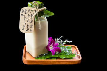 Vietnamese yogurt with flowers and sign with vietnamese text in translation Have a nice day 