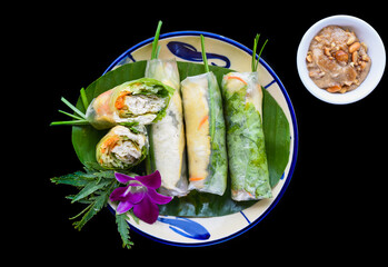 Vietnamese nem spring rolls in leaf with sauce