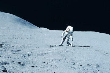 An astronaut explores the moon. Elements of this image furnishing NASA.