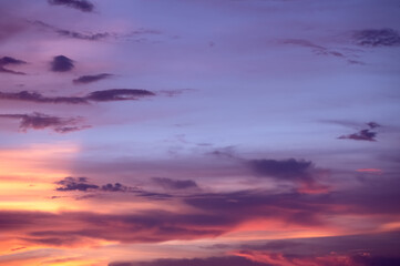 Pink sunset clouds sky background.