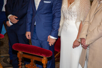 wedding married couple during the religious marriage ceremony with their witnesses