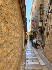 narrow cobblestone street in Hvar, Croatia
