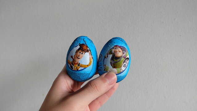 Hand holding Toy story chocolate eggs