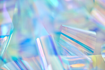 Close-up of ethereal pastel neon mint, turquoise, blue, purple holographic metallic foil...