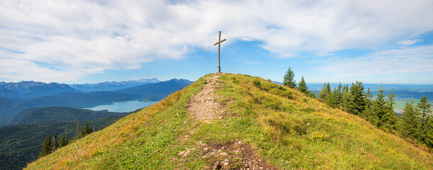 summit Hirschhornlkopf, with mountain cross and view to lake Walchensee, bavarian alps