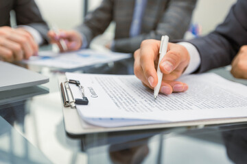 Business people read new important contract